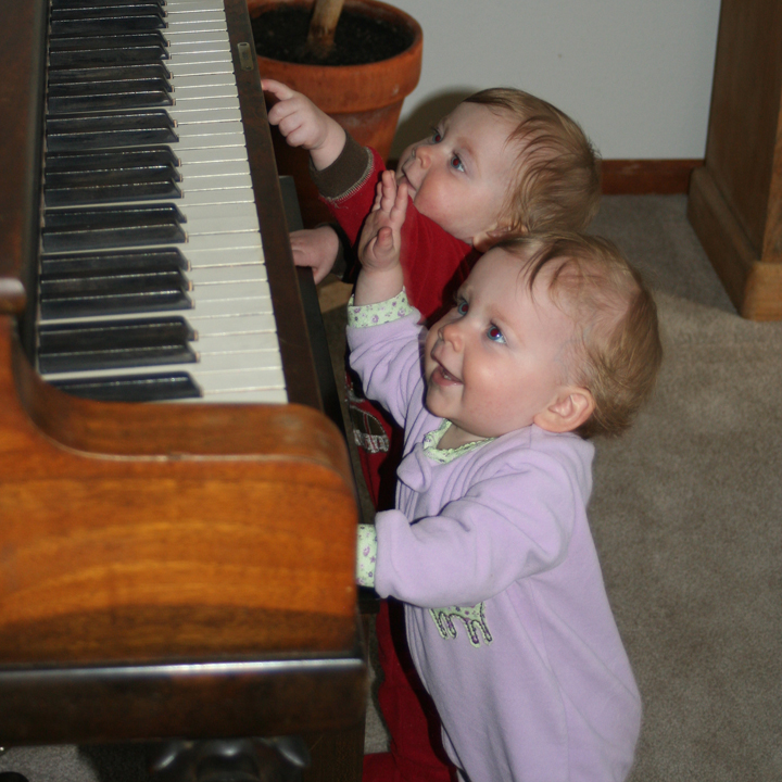 Annika and Karina playing the piano