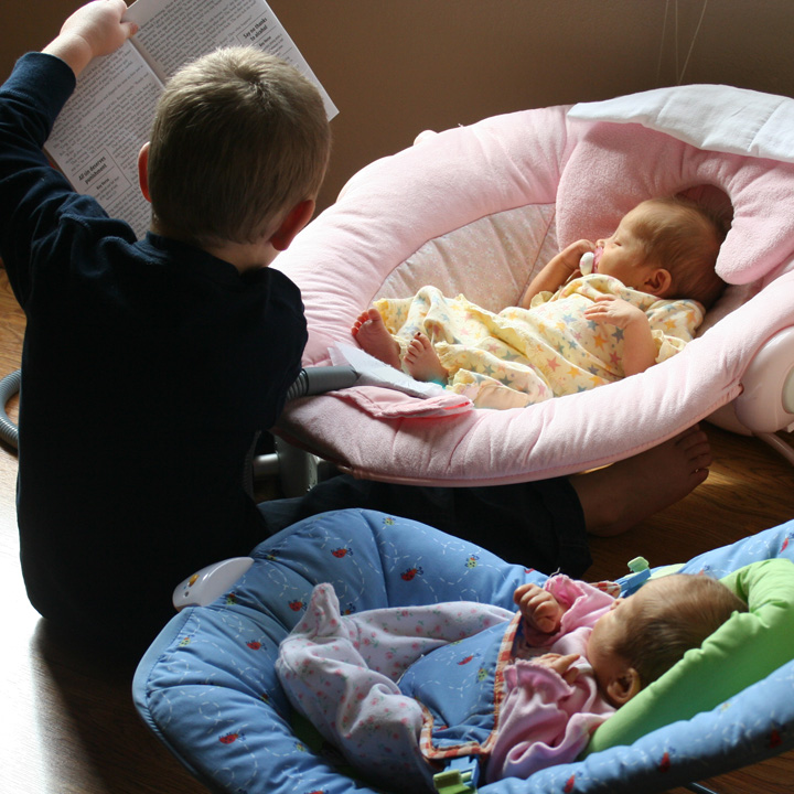 Hunter reading to Annika and Karina